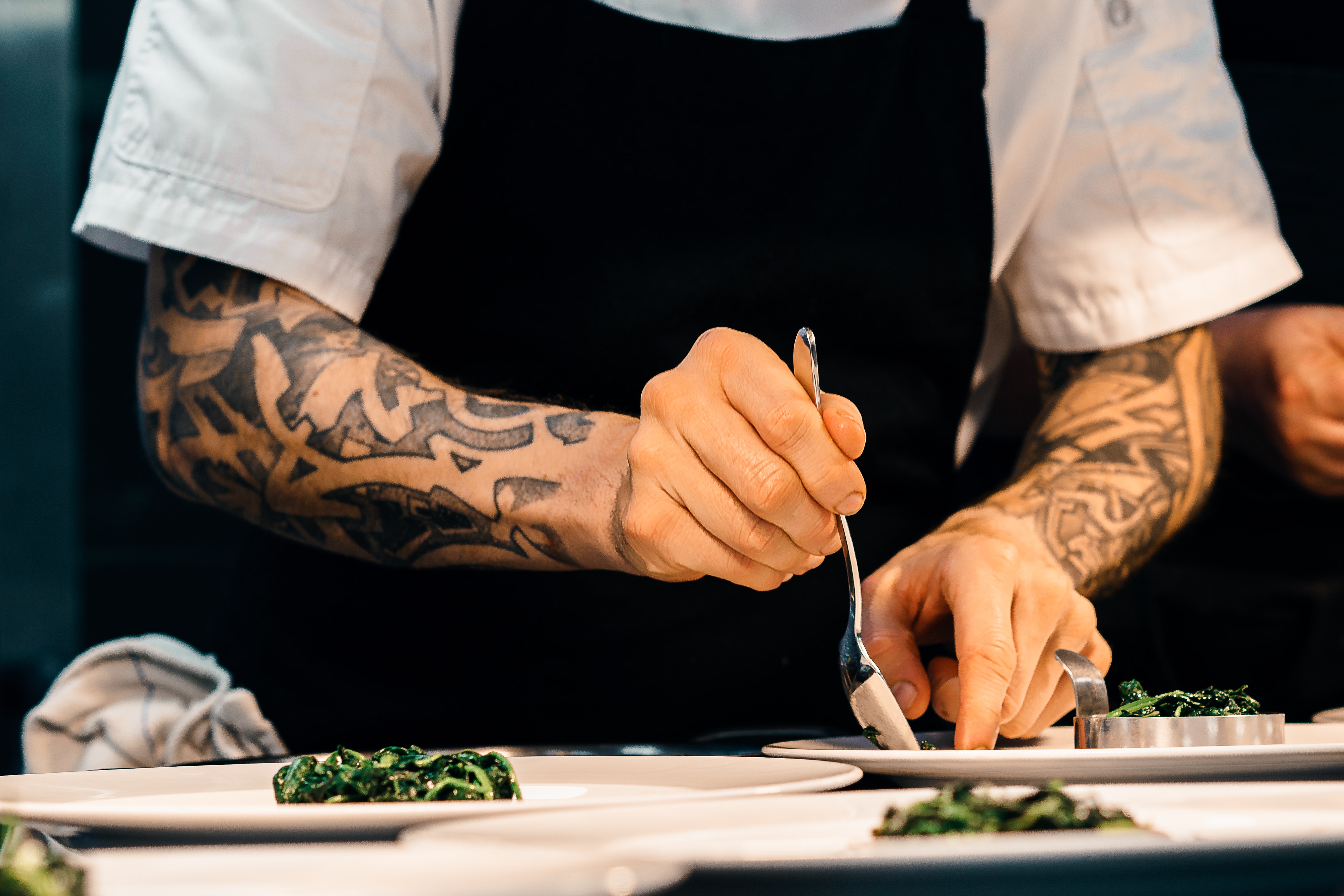 chef working in a kitchen glass countertops